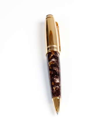 Ornate gold ball point pen isolated against whiteの写真素材