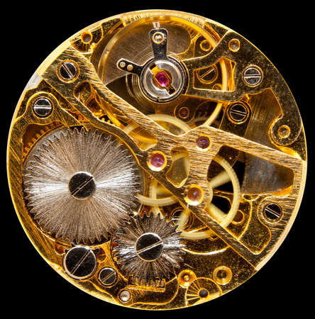 Macro shot of the interior of an old pocket watch with a hand-wown mechanical movement