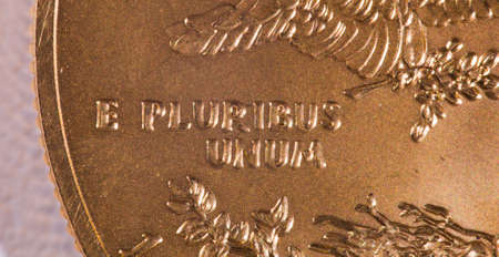Gold Eagle one ounce coins with macro shot of the engraving of E Pluribus Unumの写真素材