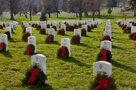 ARLINGTON, VA - DECEMBER 18: Christmas wreaths on gravestones in Arlington National Cemetery on December 18, 2011. The wreathes have been donated each year since 1992.のeditorial素材