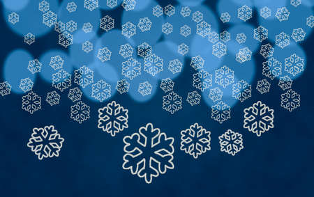 White snowflake shapes dropping in front of blue out of focus christmas tree lightsの写真素材