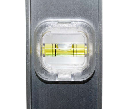 Yellow spirit level in aluminum measuring ruler in inches and cm