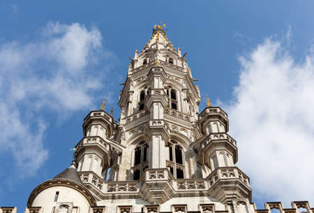 Ornate Brussels Town Hall in Grand Place with detail of towerの写真素材
