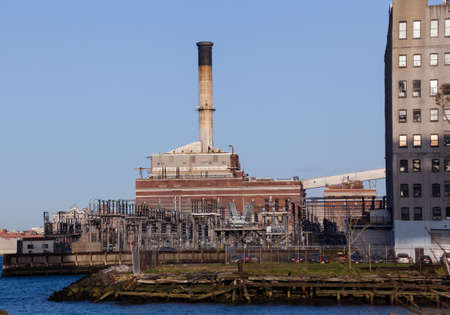 Power station on banks of Hudson river in New Yorkの写真素材