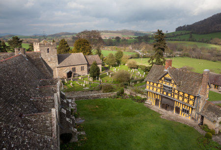 Gatehouse entrance to Stokesay castle on a dark cloudy dayのeditorial素材