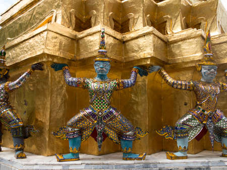 Grand Palace in Bangkok Thailand with dancing demons holding up roofの写真素材
