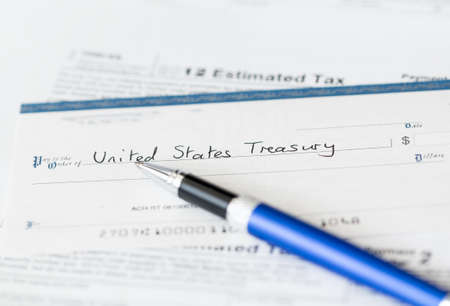 Tax form 1040 for tax year 2012 for US individual tax return with pen and checkの写真素材