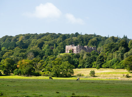 Muncaster Castle nestles in woodland on the edge of Lake District in Englandのeditorial素材