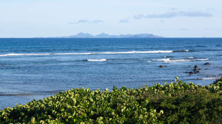 View of St Barts or St Barths from St Martin at Baie de l Embouchureの写真素材