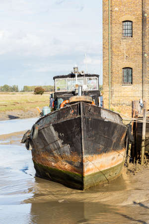Thames sailing ship or houseboat by dock in Faversham Kent UKの写真素材
