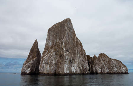 Sleeping Lion or Leon Dormida rock formation off coast of Galapagos islandsの写真素材