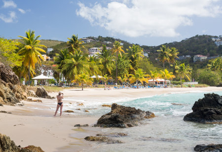 ST THOMAS, USVI- FEBRUARY 19: Tourist takes photo at Frenchman's Bay on February 19, 2013. The 15 acre resort is owned by Wyndhamのeditorial素材