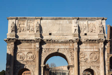 Detail of arch of Constantine and Colosseum in Ancient Romeの写真素材