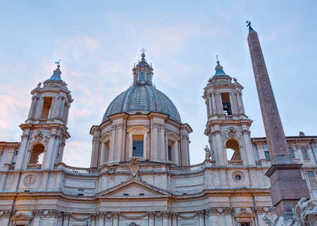 Sant Agnese in Agone lit up by setting sun in Piazza Navonaの写真素材