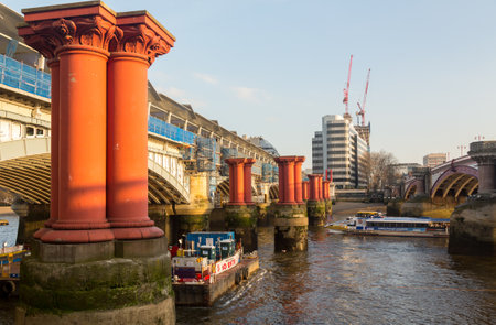 LONDON, UK - 23 APRIL: Construction of solar panels on Blackfriars rail bridge on 23 April 2013. When complete, the Blackfriars Bridge will be the worlds largest solar bridge.のeditorial素材