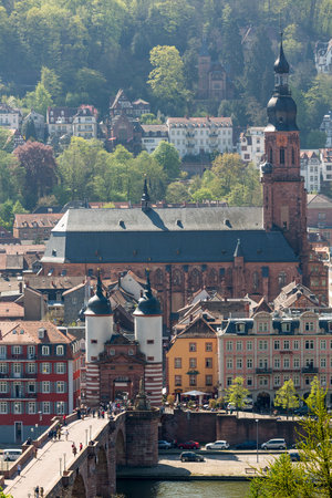 HEIDELBERG, GERMANY - APRIL 25: Tourists and locals stroll through gateway into old town on 25 April 2013. The bridge was built in 1786のeditorial素材