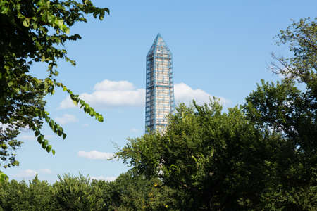555 foot tall Washington Monument encased in 500 tons of scaffolding to repair the damage caused by...