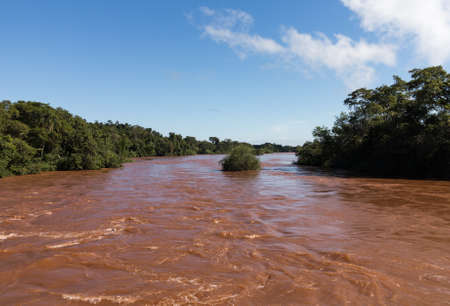 Flood swollen river leading to famous Iguassu Falls on border between Brazil and Argentinaの写真素材