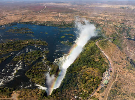 Victoria Falls (or Mosi-oa-Tunya - the Smoke that Thunders) waterfall in southern Africa on the Zambezi River at the border of Zambia and Zimbabwe. Aerial Image taken from helicopter flightの写真素材