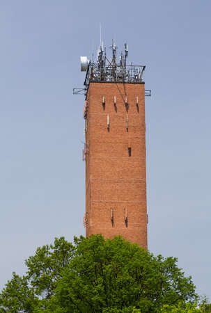 Tall brick telecoms tower in Wayne Pennsylvania used for radio masts for cellphone mobile telephonesの写真素材