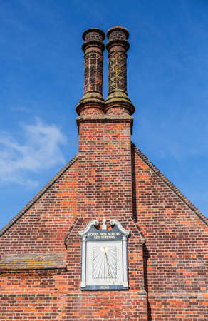 Ancient town clock on Moot Hall in Suffolk town of Aldeburgh on East Anglian coastの写真素材