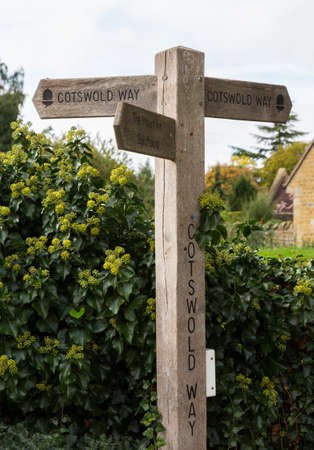 Signpost for Cotswold Way long distance path in Cotswold or Cotswolds district of southern England in the autumn.の写真素材