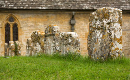 St Peters parish church in Upper Slaughter in Cotswold or Cotswolds district of southern England in the autumn.の写真素材