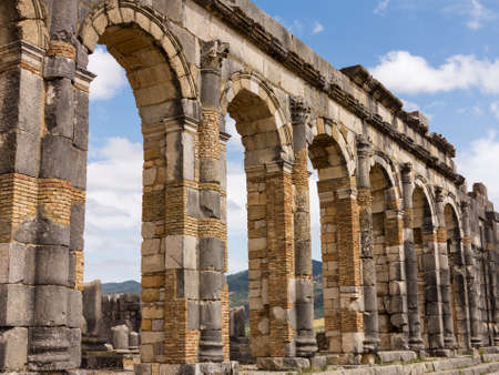 Volubilis is a partly excavated Roman city in Morocco situated near Meknes between Fes and Rabat. Built in a fertile agricultural area, it was developed from the 3rd century BC onwards as a Phoenician Carthaginian settlementの写真素材