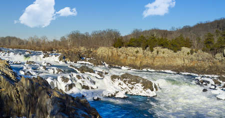 Great Falls on Potomac river outside Washington DC in winter with ice forming on the cascades and snow on the rocksの写真素材