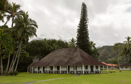 The old Waioli Huiia Mission building and hall in Hanalei Kauai with the Na Pali Mountains shrouded in mistのeditorial素材
