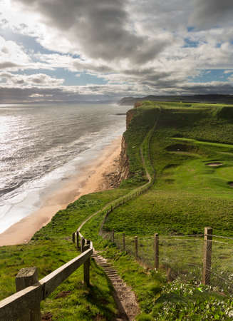 Cliff top path along the headland on Jurassic Coast cliffs  at West Bay in Dorset. This was used as the location for the Broadchurch TV seriesの写真素材