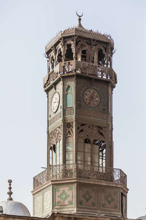 Antique brass metal clock tower of Alabaster Mosque or Mosque of Muhammad Ali Pasha in the Citadel in Cairo Egypt. Clocktower donated by King of France in 1845の写真素材