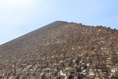 View up the side of Great Pyramid of Giza in Cairo Egypt on baking hot day with the heat haze and...