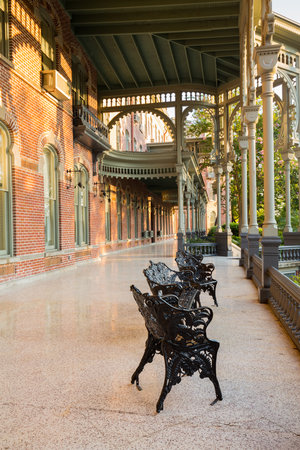 Cast iron chairs on the marble patio or balcony of Henry B Plant museum is moorish inspired architecture part of the University of Tampa.のeditorial素材