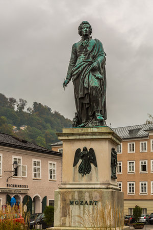 Statue of Mozart on cloudy rainy day in Salzburg Austriaのeditorial素材