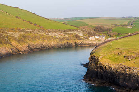 South West Coast Path along hillside above village of Port Quin, Cornwall, England, UKの写真素材