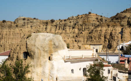 Small cave house built into the hillside of small hill in Purullena near Guadix, Andalucia, Spainの写真素材