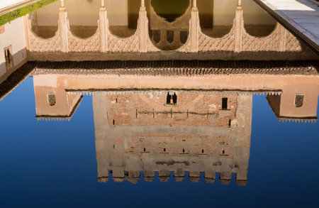 Courtyard and reflecting pool in Palacios Nazaries in Alhambra palace in ancient city of Granada in...