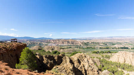 View from Mirador of rugged dry badlands in gorge outside Guadix Andalucia, Spainの写真素材