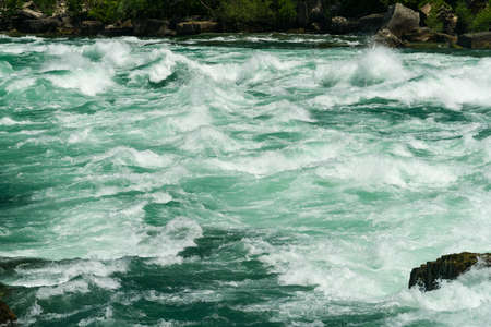 Class six rapids in river by White Water Walk near whirlpool rapids at Niagara Falls