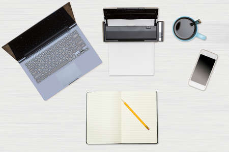 Tidy organized desk top with laptop, scanner and electronics with cup of coffee or tea on white...