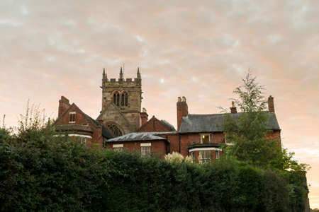 Church tower of parish church in Ellesmere Shropshire in England at sunsetの写真素材