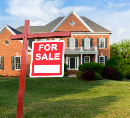 For Sale   sign in front of large brick single family house in expansive grass yard for real estate...