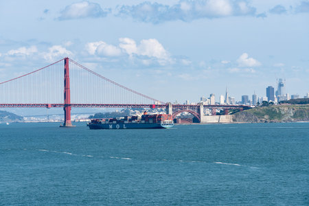 SAN FRANCISCO - APRIL 19: MOL container ship enters San Francisco Bay under Golden Gate Bridge on...