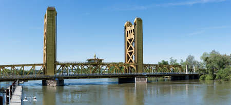 Yellow drawbridge known as Tower Bridge Gateway across Sacramento river in Capital of Californiaの写真素材