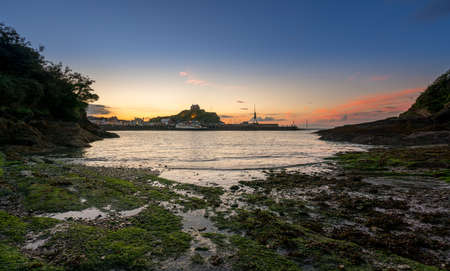 Panorama of the seaside town of Ilfracombe in Devon at sunset with view over harbor and housesの写真素材