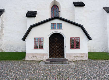 Carved wooden entrance to cathedral church in ancient town of Porvoo in Finlandの写真素材