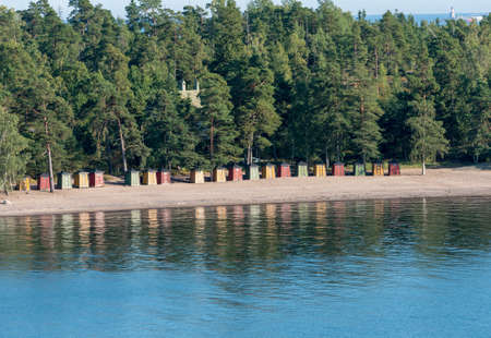 Collection of colorful beach huts on the beach on Pihlajasaari Island near Helsinki, Finlandの写真素材