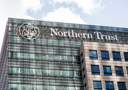 LONDON, UK - JANUARY 30, 2016: Logo or sign for Northern Trust bank on side of office building in Canary Wharf, Docklands, London, Englandのeditorial素材