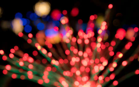 Defocused bokeh of christmas tree lights to be used as abstract background for holiday image